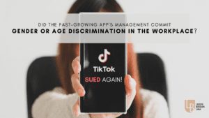 A person holding up a phone with the words " tiktok sued again !" on it.